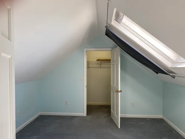 an empty room with wooden floor