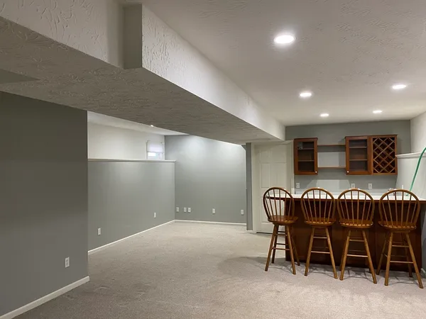 a view of a dining room that has a table and chairs