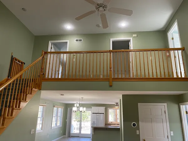 a view of entryway and hall with a window