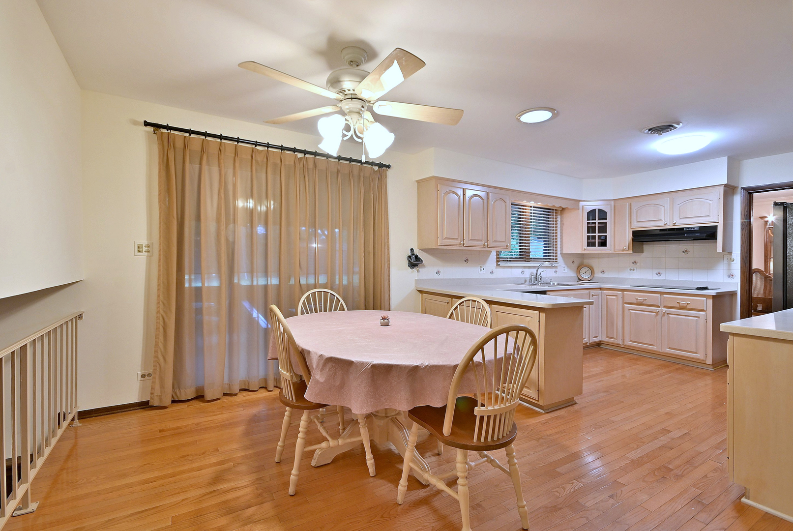 7976 Clarendon Hills Road Willowbrook, IL 60527 - Photo 14 of 41 a view of a dining room with furniture window and wooden floor