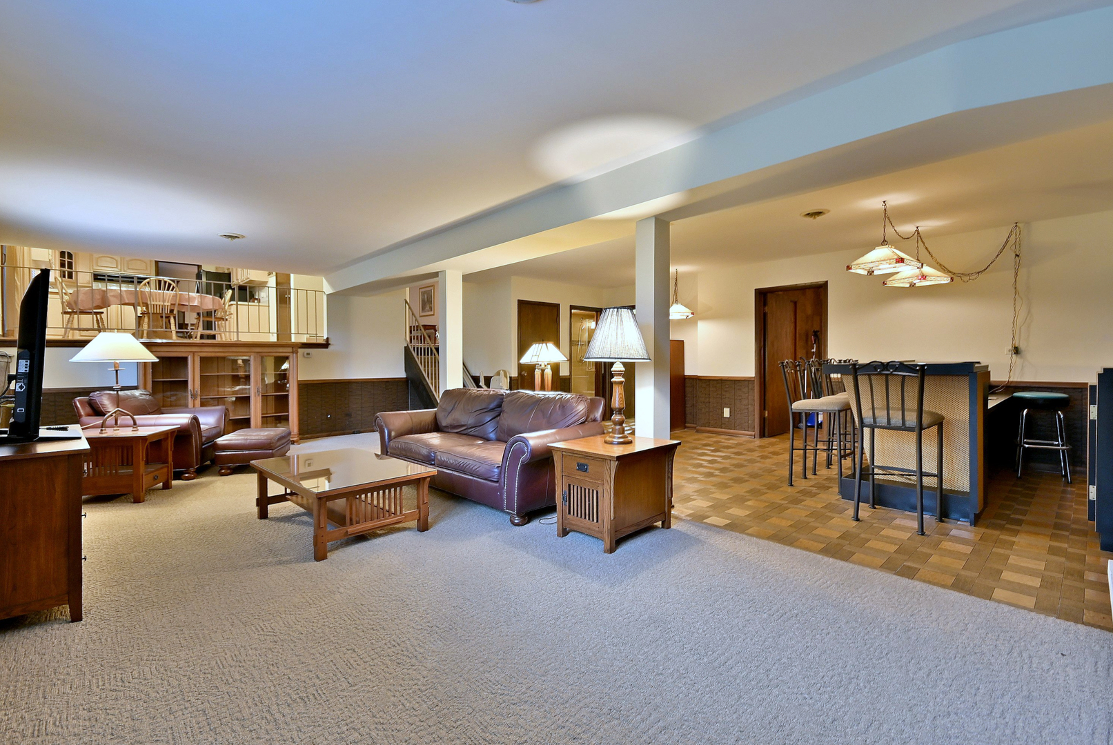 7976 Clarendon Hills Road Willowbrook, IL 60527 - Photo 16 of 41 a living room with furniture and a dining table