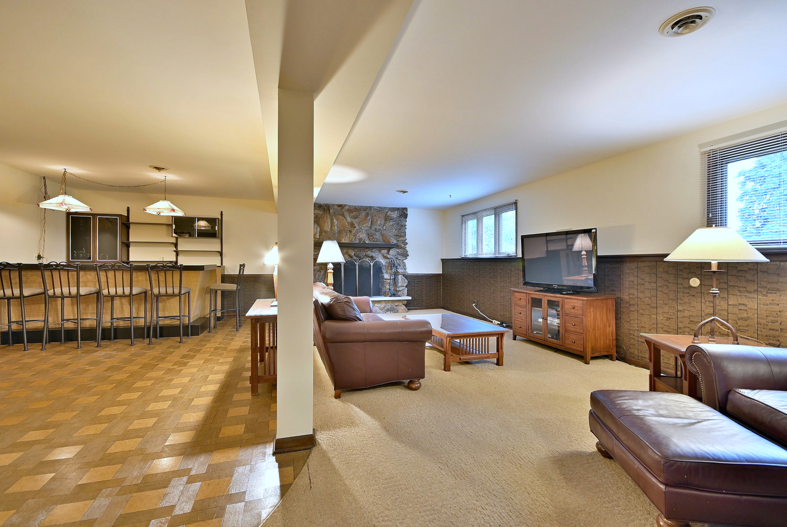 7976 Clarendon Hills Road Willowbrook, IL 60527 - Photo 18 of 41 a living room with furniture and a table