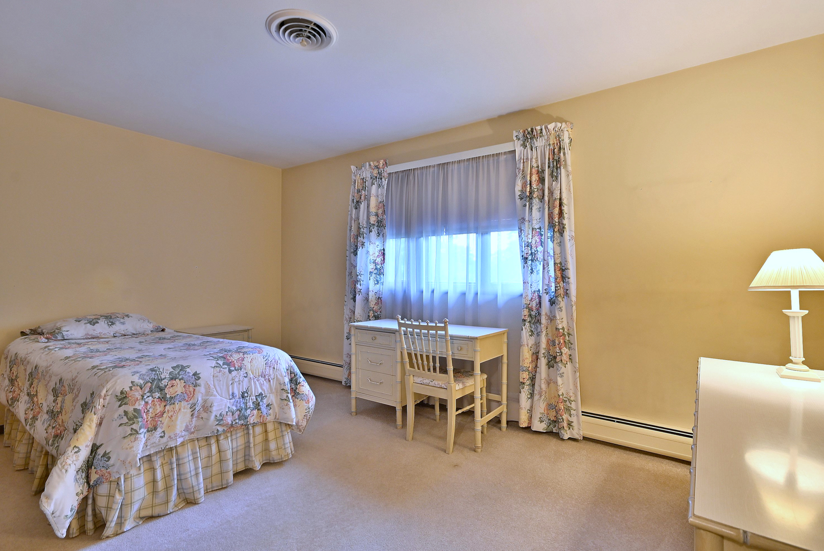 7976 Clarendon Hills Road Willowbrook, IL 60527 - Photo 28 of 41 a bedroom with a bed and a chair