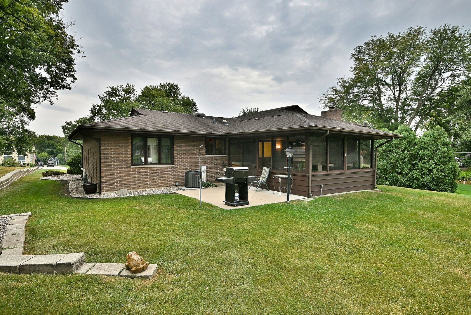 7976 Clarendon Hills Road Willowbrook, IL 60527 - Photo 39 of 41 a view of a house with backyard sitting area and garden