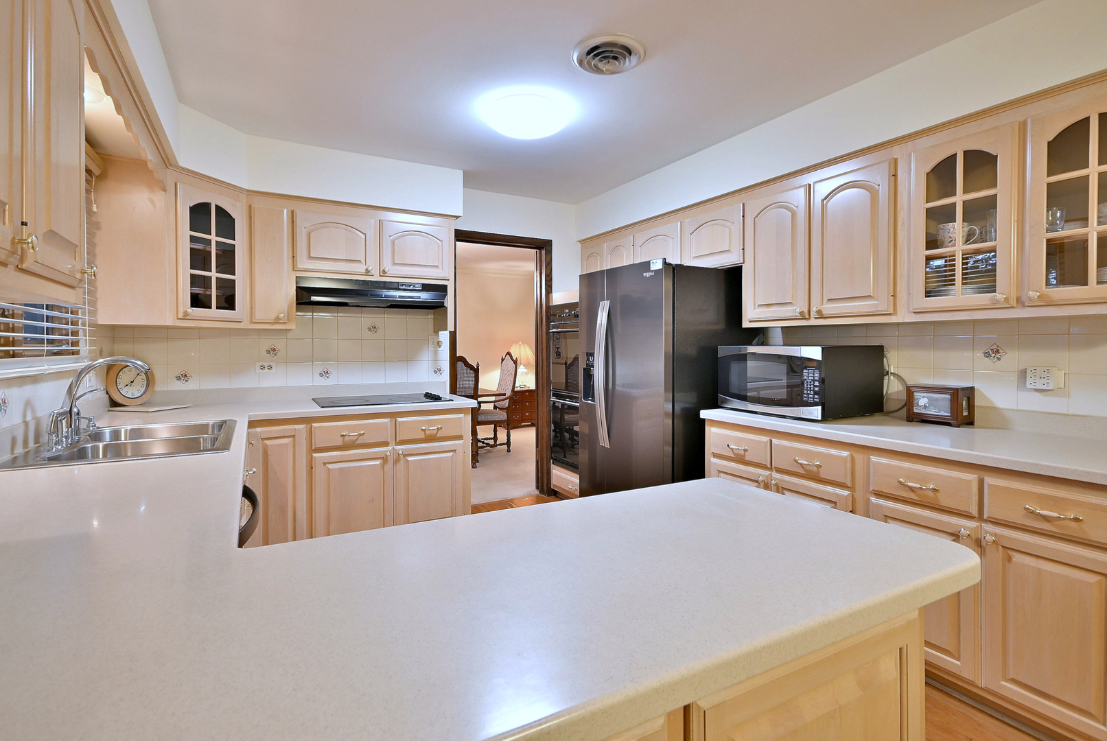 7976 Clarendon Hills Road Willowbrook, IL 60527 - Photo 10 of 41 a kitchen with granite countertop a refrigerator stove top oven and sink