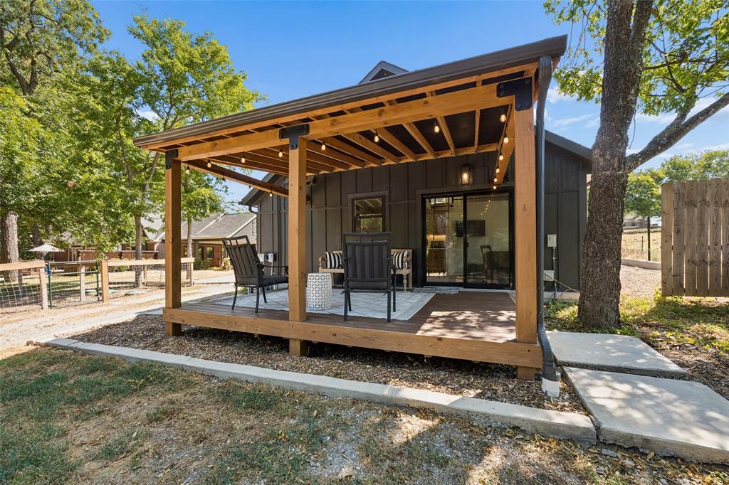 331 Larkin Road Sunnyvale, TX 75182 - Photo 35 of 40 Guests Are Sure To Enjoy Their Morning Coffee on The Back Porch Overlooking the Grounds