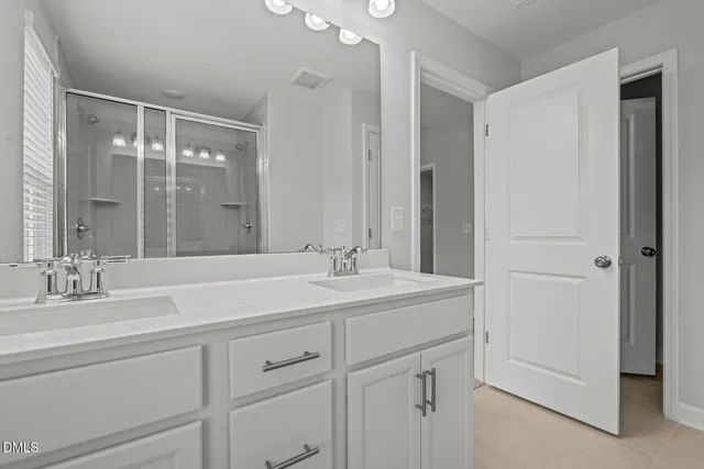 a bathroom with a sink and a shower