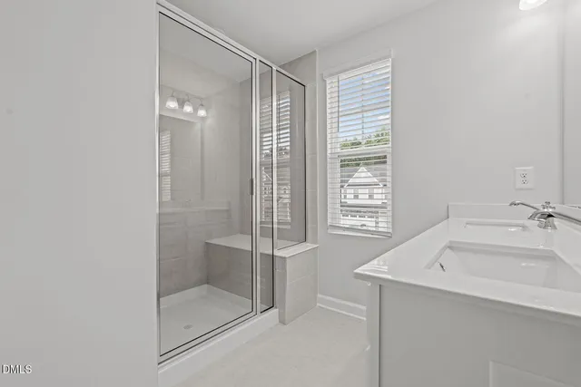 a bathroom with a granite countertop sink mirror and toilet