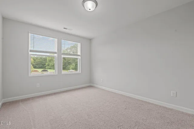 a picture of a bench in front of a building