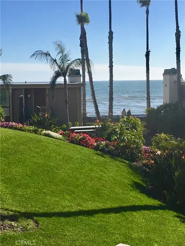 a front view of a building with garden