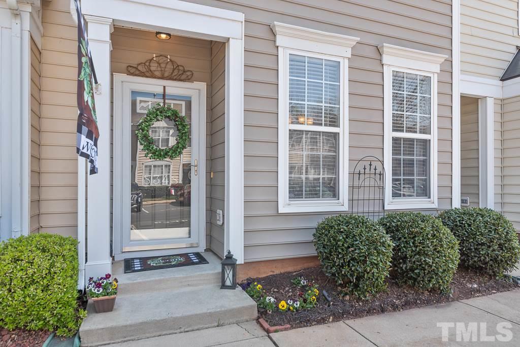 8348 City Loft Court Raleigh, NC 27613 - Photo 2 of 24 a front view of a house with a yard