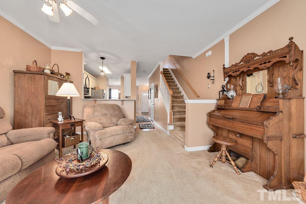 8348 City Loft Court Raleigh, NC 27613 - Photo 14 of 24 a living room with furniture and a wooden floor