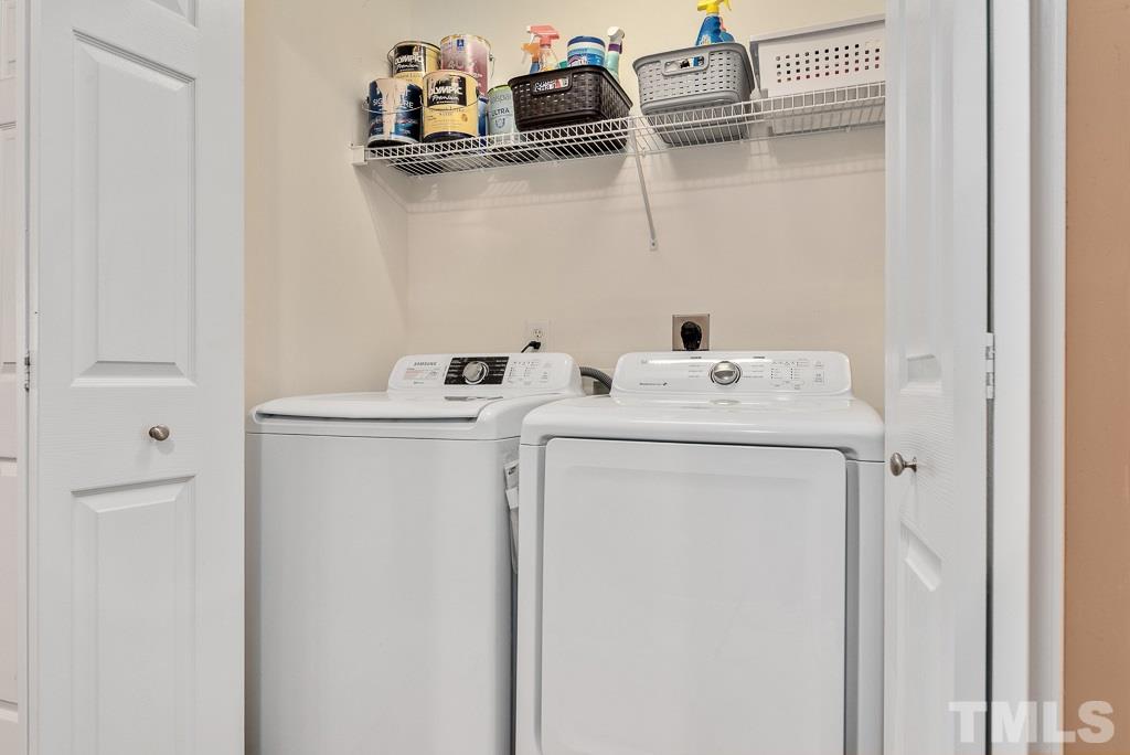 8348 City Loft Court Raleigh, NC 27613 - Photo 21 of 24 a utility room with dryer and washer