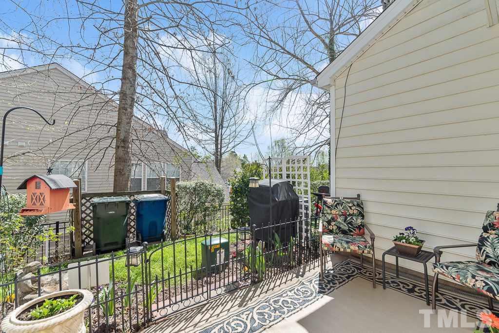 8348 City Loft Court Raleigh, NC 27613 - Photo 22 of 24 a backyard of a house with outdoor seating
