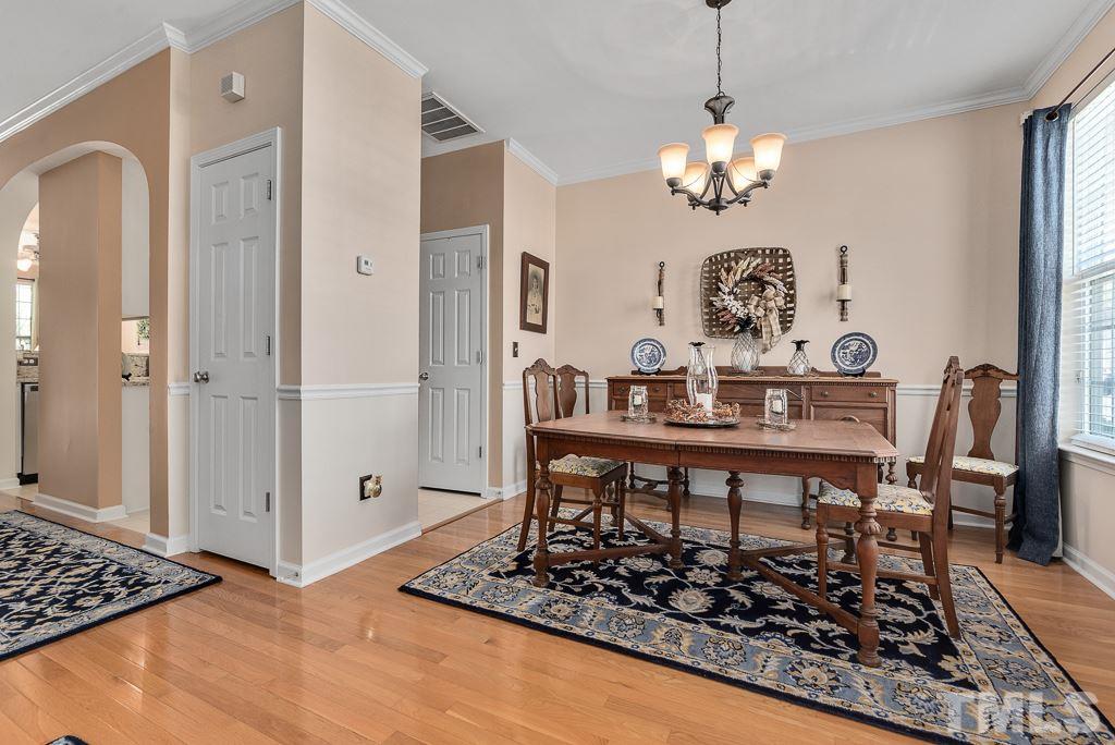8348 City Loft Court Raleigh, NC 27613 - Photo 5 of 24 a view of a dining room with furniture