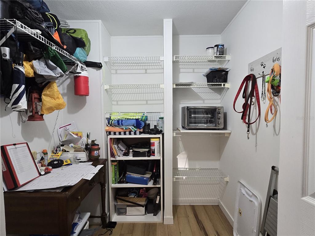 4146 Greenbluff Road, Unit 817 Zellwood, FL 32798 - Photo 19 of 40 a view of walk in closet with clothes and shoes