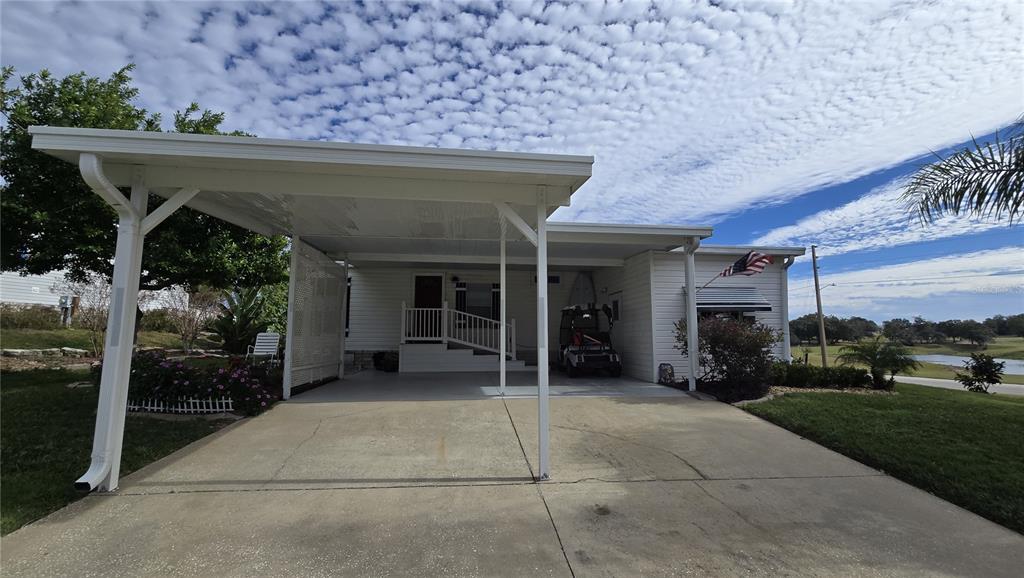 4146 Greenbluff Road, Unit 817 Zellwood, FL 32798 - Photo 2 of 40 front view of a house with a porch