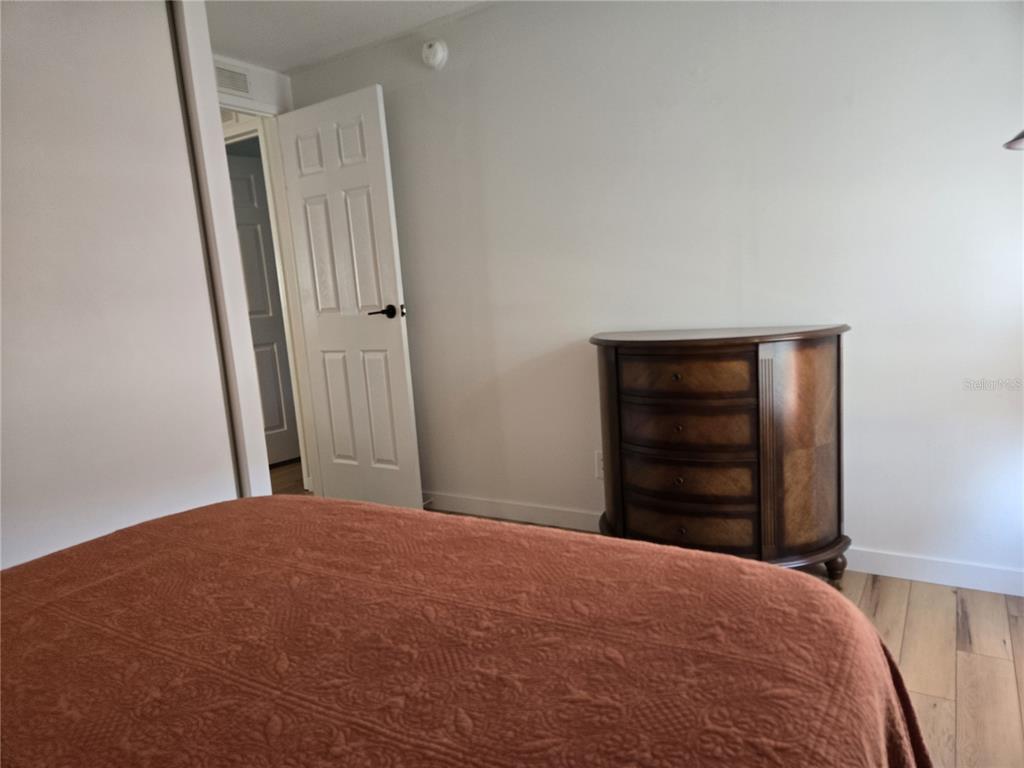 4146 Greenbluff Road, Unit 817 Zellwood, FL 32798 - Photo 24 of 40 a bedroom with a bed and closet