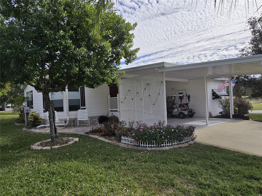 4146 Greenbluff Road, Unit 817 Zellwood, FL 32798 - Photo 3 of 40 a front view of a house with a yard