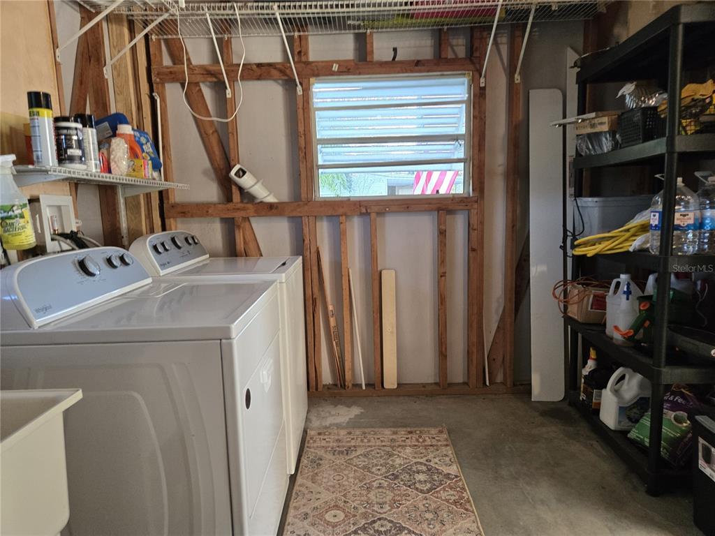 4146 Greenbluff Road, Unit 817 Zellwood, FL 32798 - Photo 39 of 40 a utility room with dryer and washer