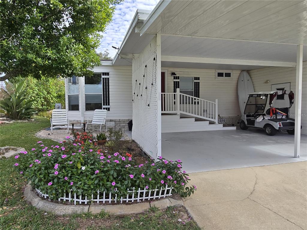 4146 Greenbluff Road, Unit 817 Zellwood, FL 32798 - Photo 5 of 40 a front view of a house with a garden