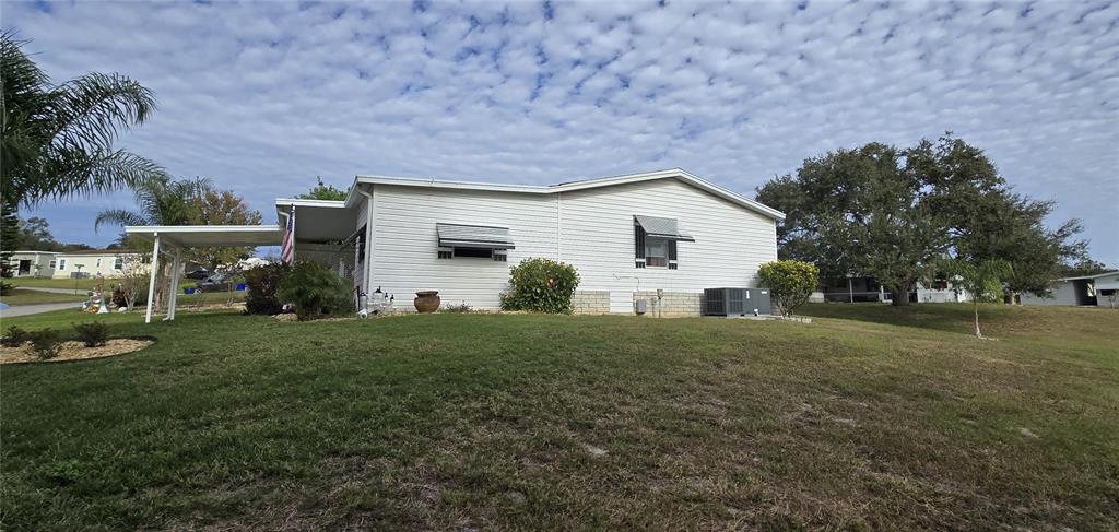 4146 Greenbluff Road, Unit 817 Zellwood, FL 32798 - Photo 6 of 40 a view of a house with backyard and garden