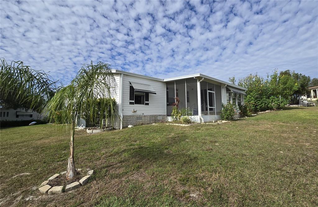4146 Greenbluff Road, Unit 817 Zellwood, FL 32798 - Photo 7 of 40 a view of a house with backyard and garden