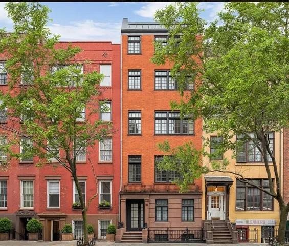 a flower garden is sitting in front of a building