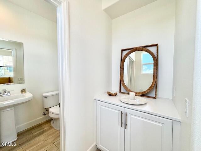 3640 Islander Walk Oxnard, CA 93035 - Photo 15 of 31 a bathroom with a toilet a sink and a mirror