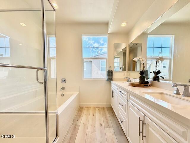 3640 Islander Walk Oxnard, CA 93035 - Photo 19 of 31 a spacious bathroom with a tub sink and mirror