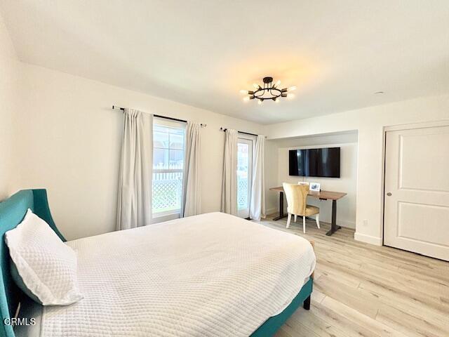 3640 Islander Walk Oxnard, CA 93035 - Photo 29 of 31 a bedroom with a bed and a flat screen tv