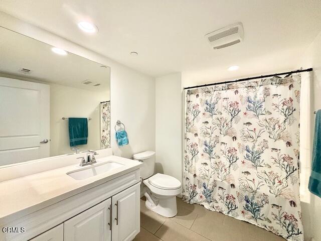 3640 Islander Walk Oxnard, CA 93035 - Photo 30 of 31 a bathroom with a granite countertop sink a toilet and a shower