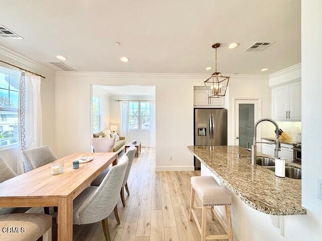 3640 Islander Walk Oxnard, CA 93035 - Photo 8 of 31 a large kitchen with a table and chairs