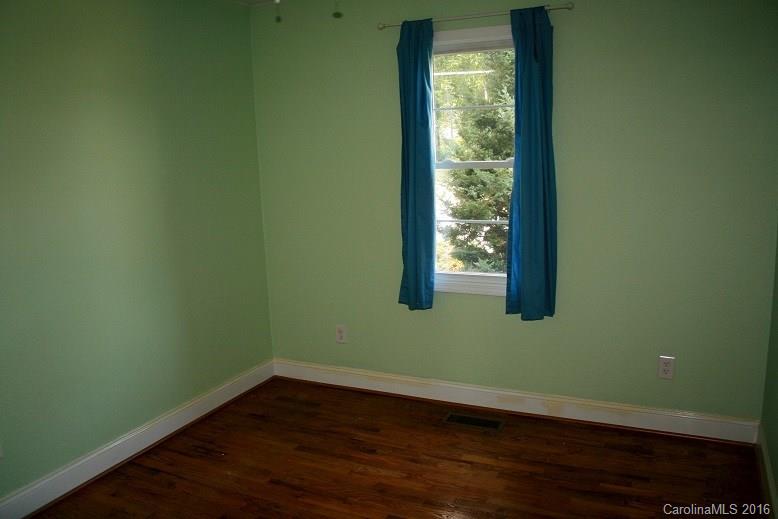 117 Pine Street Rutherfordton, NC 28139 - Photo 5 of 14 a view of a small space with wooden floor and a window