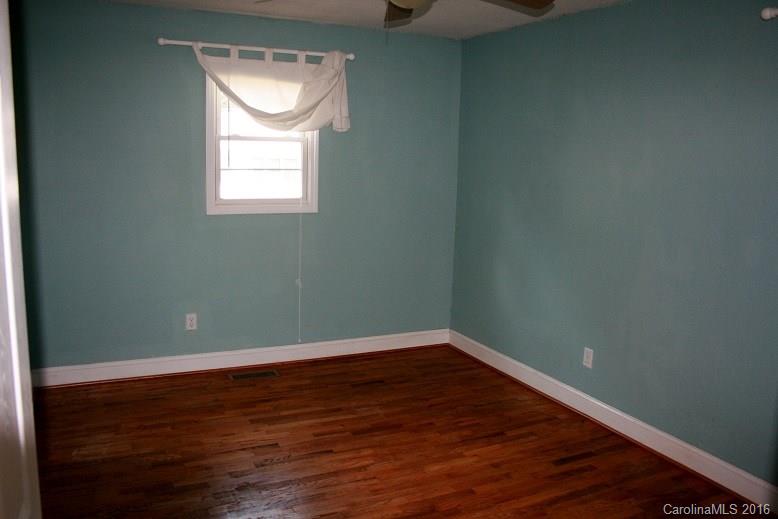 117 Pine Street Rutherfordton, NC 28139 - Photo 6 of 14 a view of a small space with wooden floor and a window