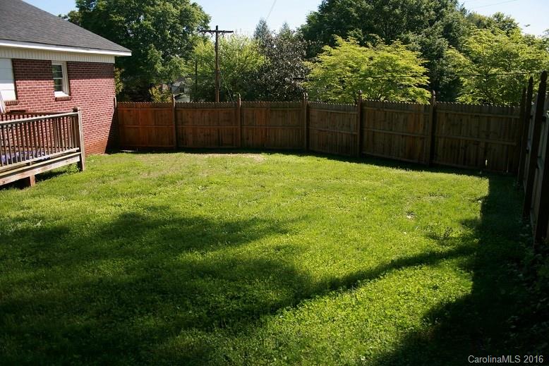 117 Pine Street Rutherfordton, NC 28139 - Photo 9 of 14 a view of backyard with wooden fence