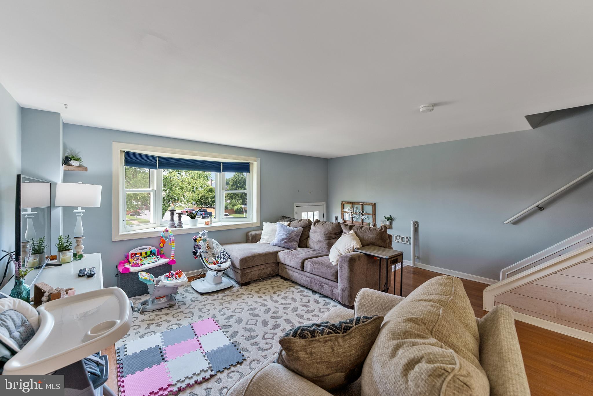 5633 Chelwynd Road Halethorpe, MD 21227 - Photo 12 of 41 a living room with furniture and a large window