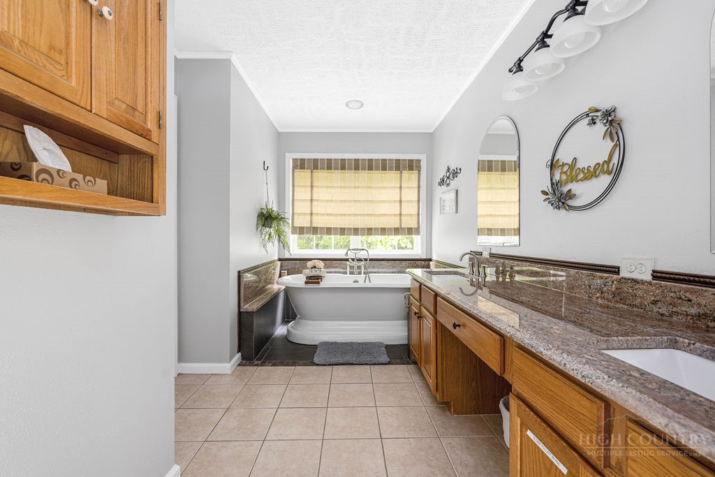 970 Vox Road Sparta, NC 28675 - Photo 31 of 50 a large white kitchen with a large window