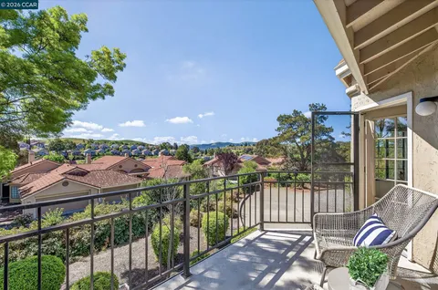 a view of a balcony with a swing