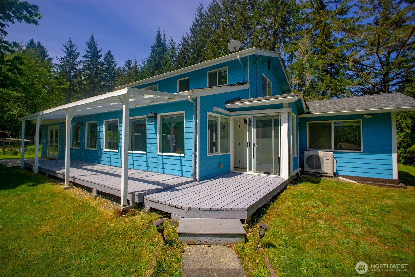 89 Slab Camp Road Sequim, WA 98382 - Photo 38 of 40 a view of a house with backyard and porch