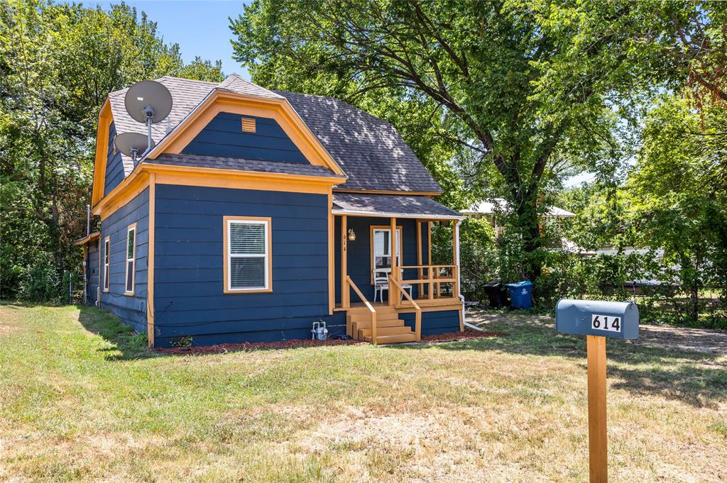 614 Rice Street Denison, TX 75020 - Photo 12 of 22 Tucked into the trees, this home just calls you into it.