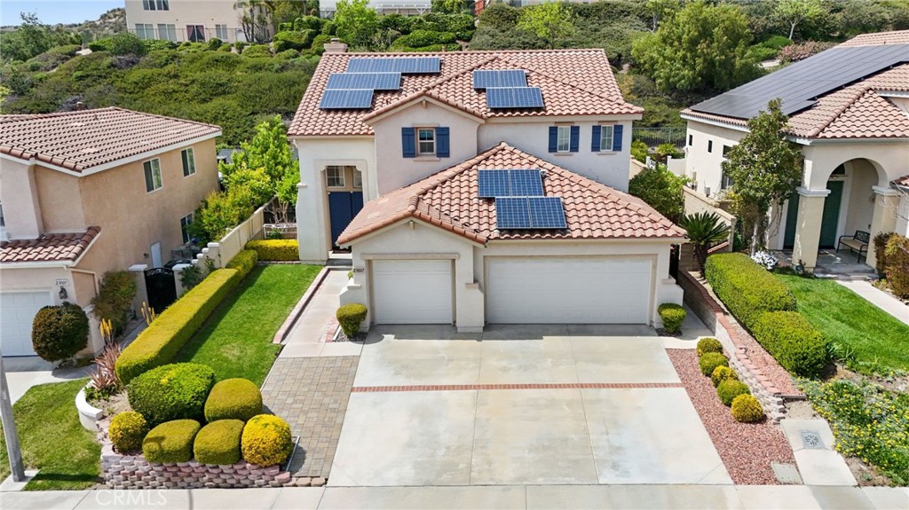 a aerial view of a house with swimming pool and furniture