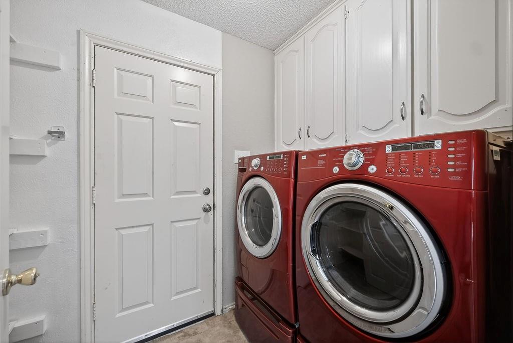 2229 Country Valley Road Garland, TX 75041 - Photo 12 of 34 a utility room with dryer and washer