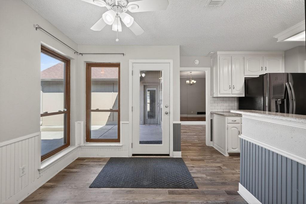 2229 Country Valley Road Garland, TX 75041 - Photo 14 of 34 a kitchen with a refrigerator and a stove top oven