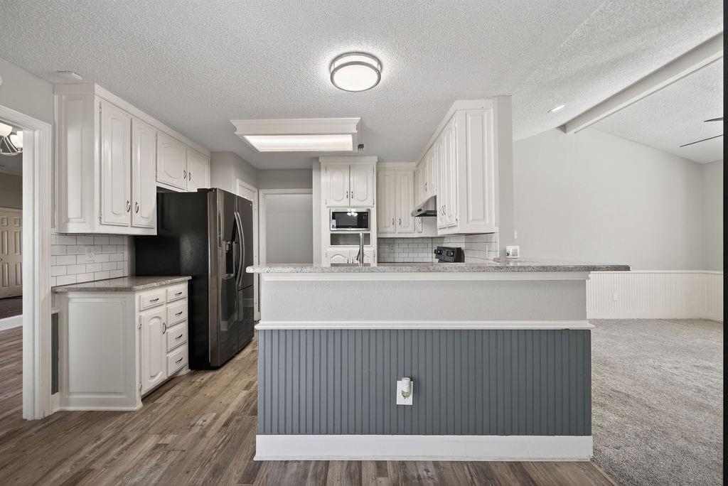 2229 Country Valley Road Garland, TX 75041 - Photo 18 of 34 a view of kitchen with wooden floor