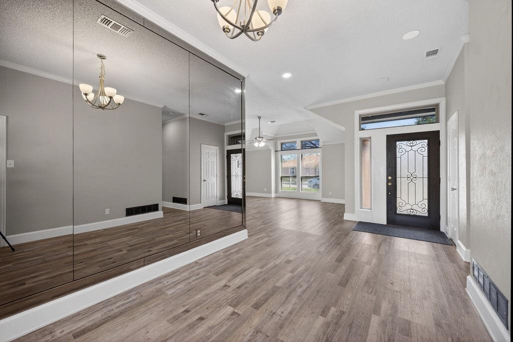 2229 Country Valley Road Garland, TX 75041 - Photo 21 of 34 a view of a room with wooden floor and window