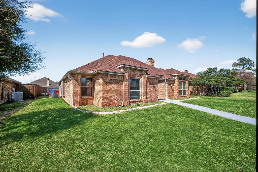 2229 Country Valley Road Garland, TX 75041 - Photo 4 of 34 a view of a house with a yard