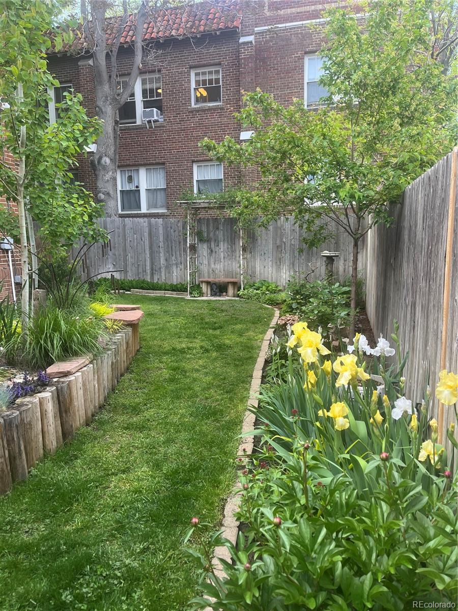 943 Emerson Street, Unit 4 Denver, CO 80218 - Photo 15 of 17 a backyard of a house with lots of green space