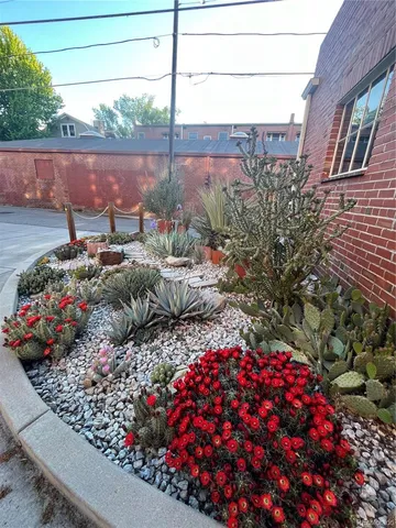 a view of a backyard with sitting area