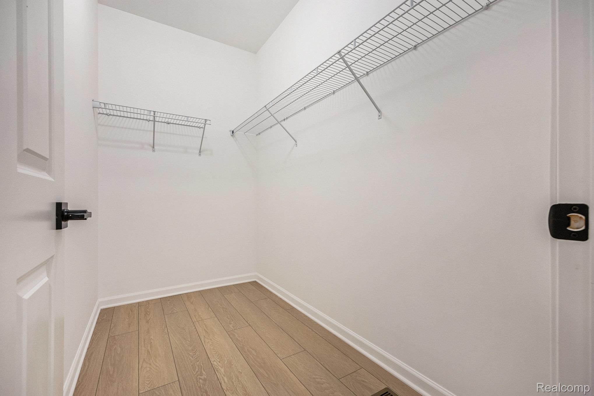 68788 Place Road New Haven, MI 48050 - Photo 27 of 29 Spacious closet with light wood-style flooring